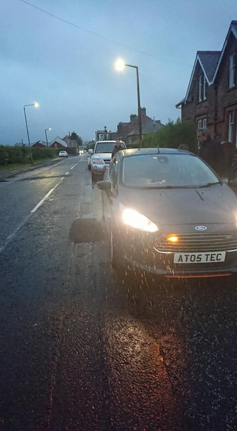 A parked car on the side of the road