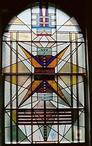 a stained glass window with an eccentric geometric pattern