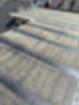 A flat roof with parallel dark stripes