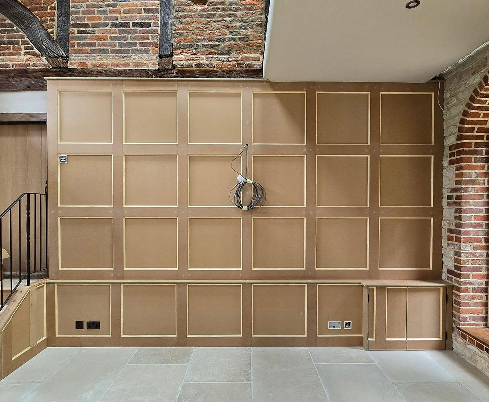 Interior wall featuring wood paneling with a brown finish