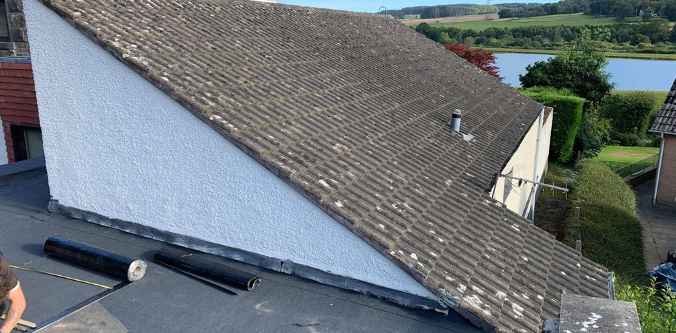A sloped rooftop with worn tiles