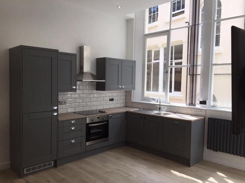 A modern kitchen with modern lighting and switchboards