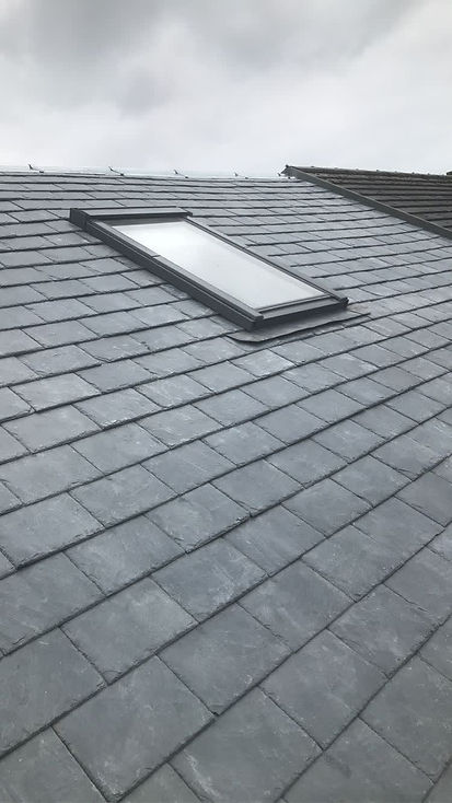 An aerial view of clean grey roof tiles
