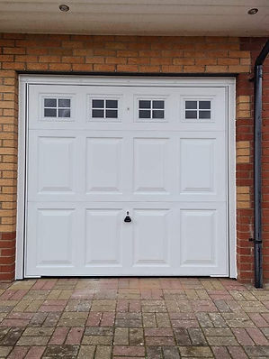 White garage door with a classic panel design