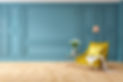 A stylishly furnished modern living room with teal wood-panelled walls