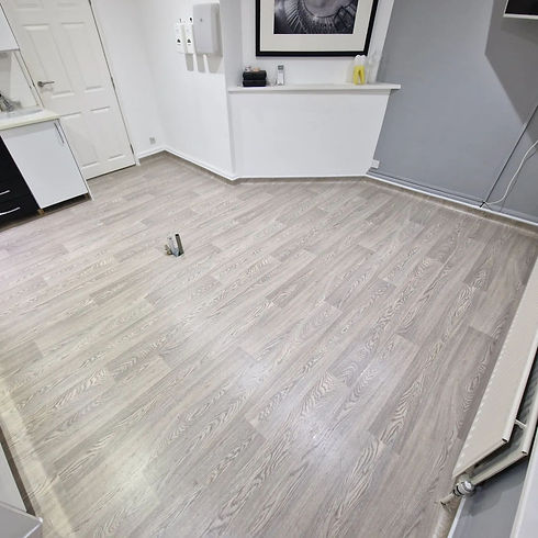 Bright room with light grey wood-patterned flooring