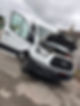 A white Ford van with its hood open