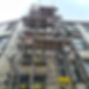 Scaffolding set up on the side of a building for construction or maintenance