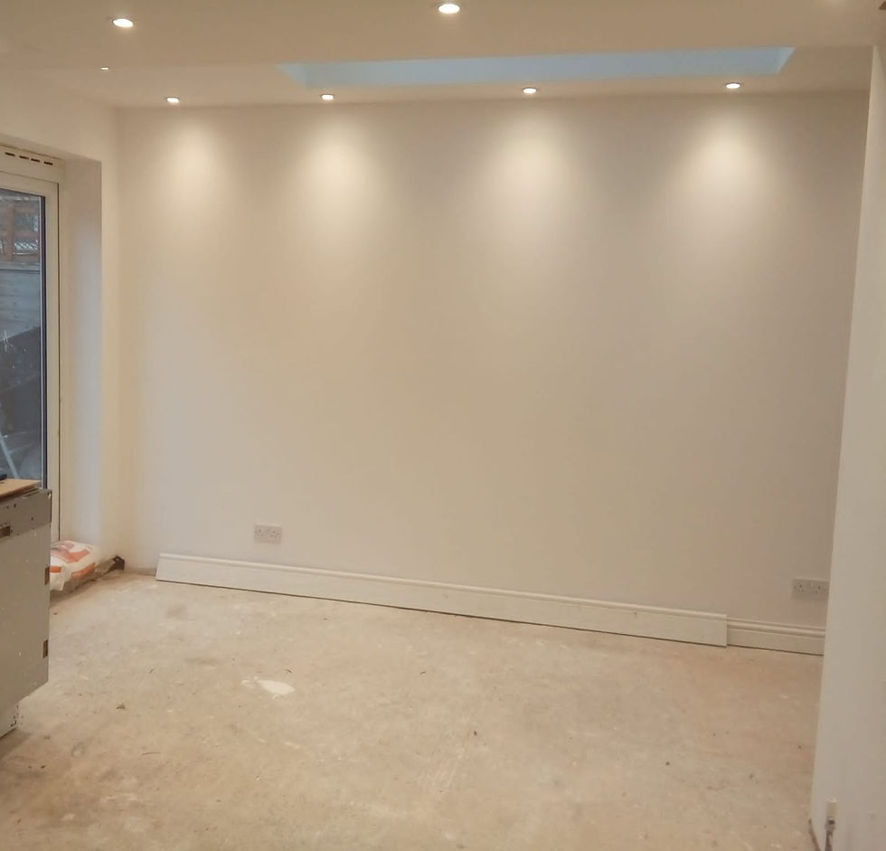 an unfinished room with freshly painted white walls