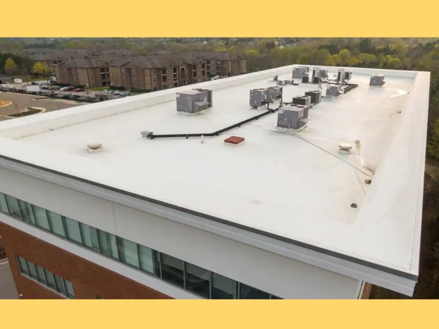 Aerial view of a commercial flat roof showing roofing membrane, HVAC units and drainage areas relevant to roof inspection cost in Ontario.