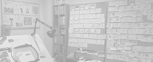 Storyboard artist workspace with story drawings and animation materials