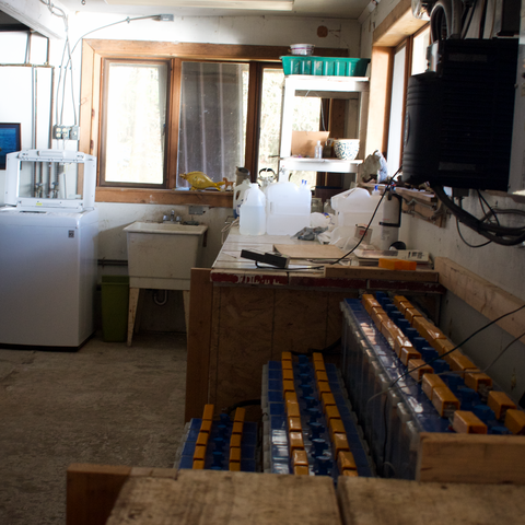Daylight Basement facing north, battery bank, utility sink, washing machine, corner work space, Waterfront Homestead for sale, Kupreanof Island Alaska
