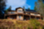 Close up view of two story house and solar panels - 2.61 acres Waterfront Homestead for sale, Kupreanof Island Alaska