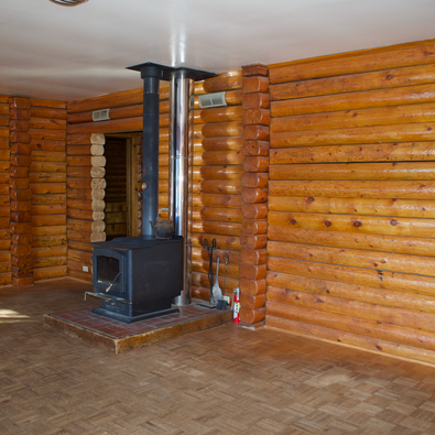 2nd floor - Interior log walls with wood stove, den & hall entry, Waterfront Homestead for sale, Kupreanof Island Alaska