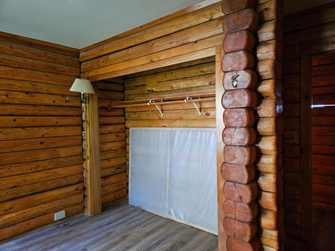 2nd floor - Master bedroom, closet 1 of 2, log interior, Waterfront Homestead for sale, Kupreanof Island Alaska