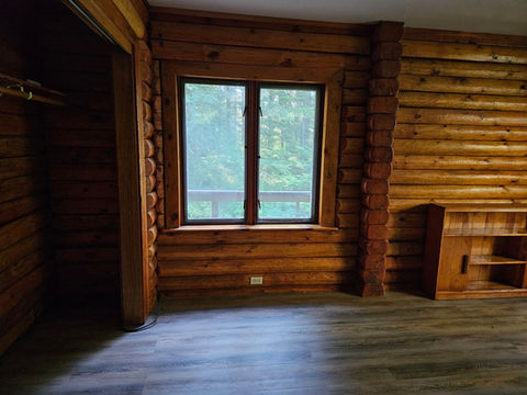 2nd floor - Master bedroom, south facing windows, closet 2 of 2 on the left, log interior, Waterfront Homestead for sale, Kupreanof Island Alaska