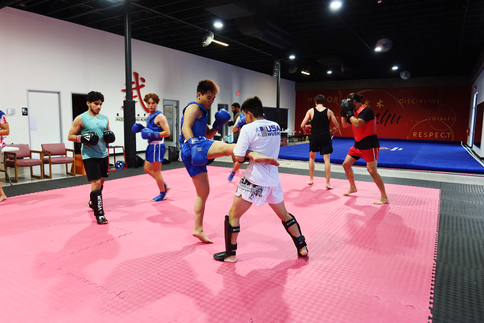 Boy practicing mma with another boy