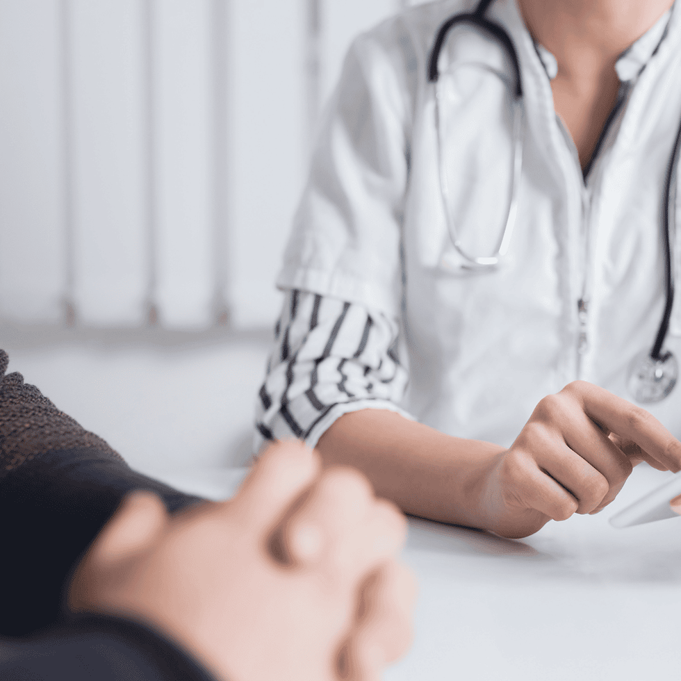 man discussing sexual health with doctor