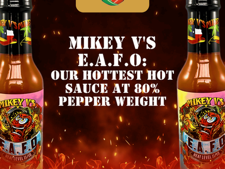 Two Mikey V's E.A.F.O. hot sauce bottles flank bold text: Our hottest hot sauce at 80% pepper weight, with flames and sparks.