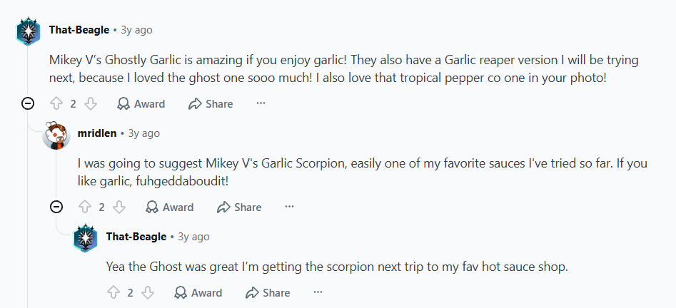 Reddit comment thread praising Mikey V’s Ghostly Garlic and Garlic Scorpion sauces, with replies and upvote/share icons.