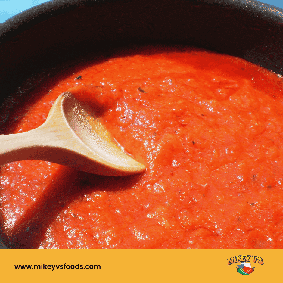 stirring pot of hot sauce