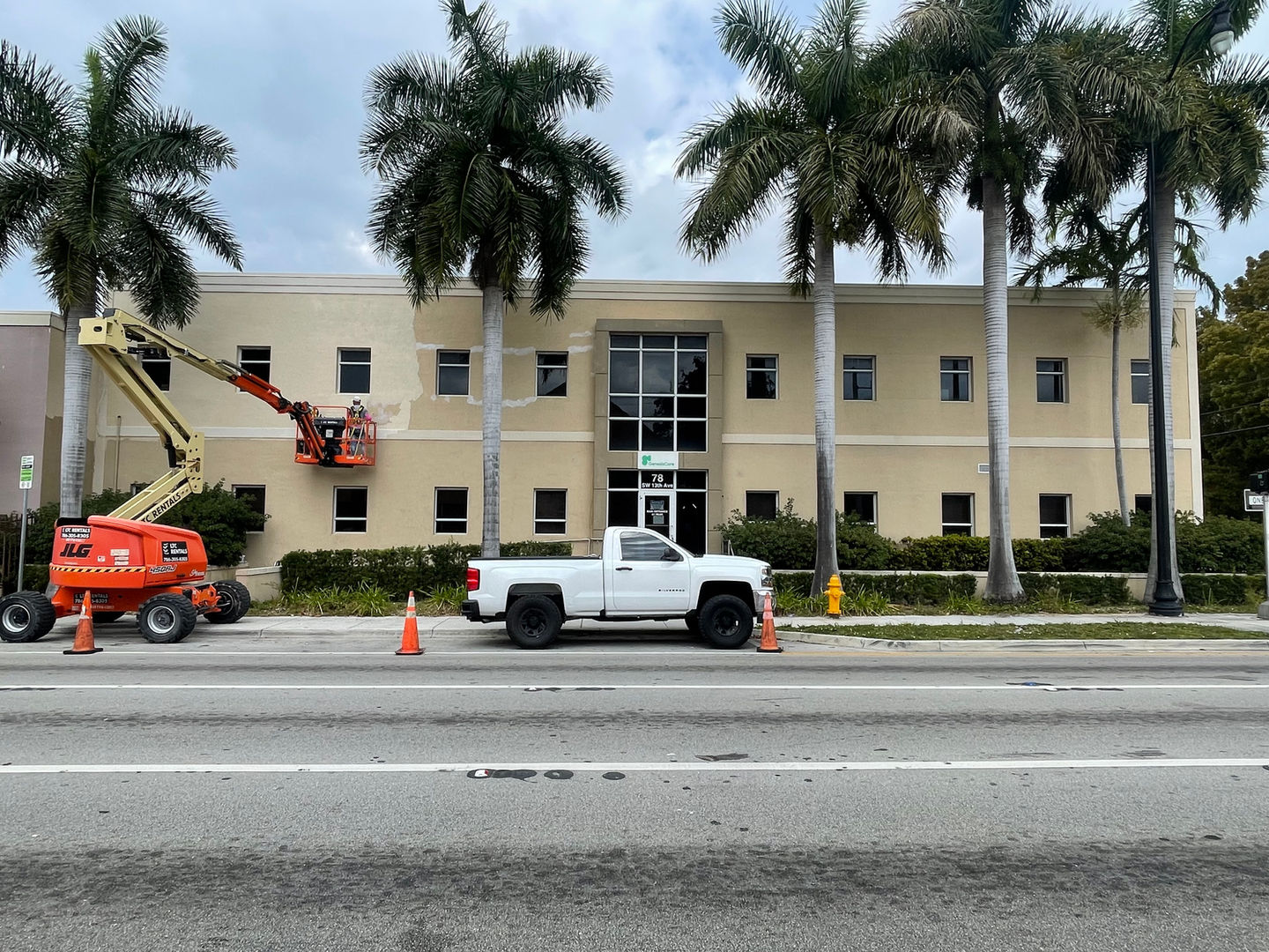 Pressure washing and exterior repainting of a commercial building.
