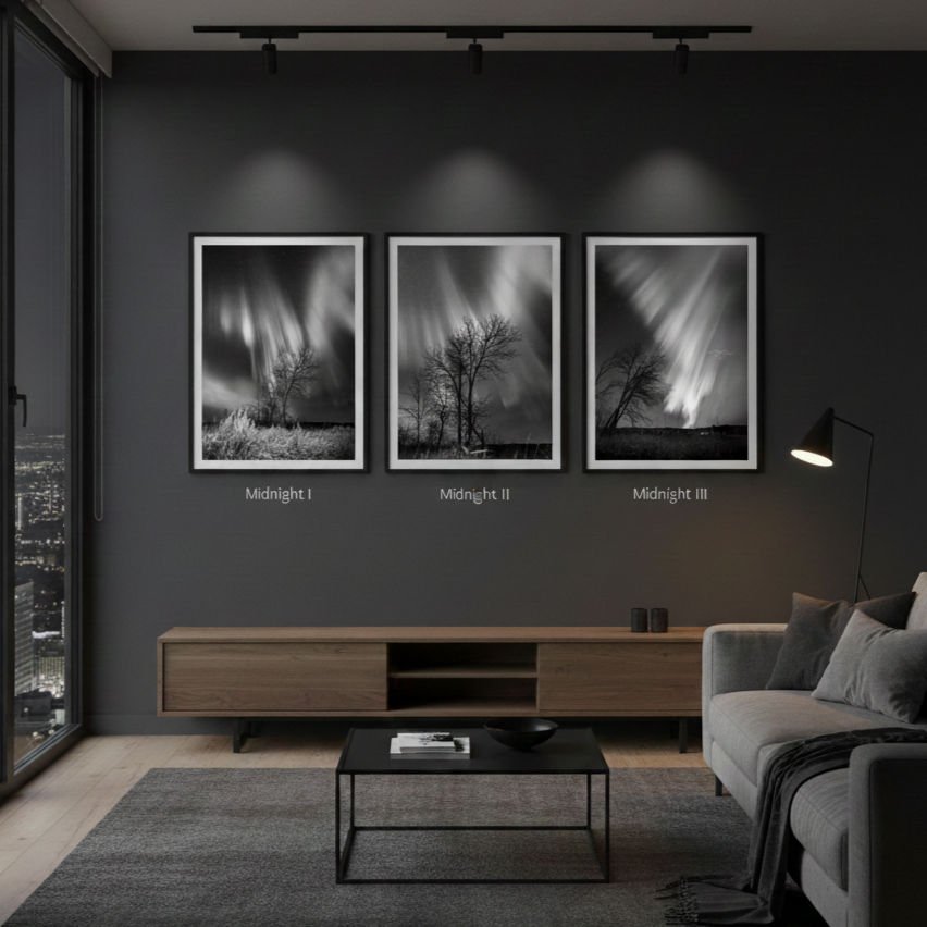 Modern living room with gray tones. Three black-and-white photos labeled "Midnight I", "II", "III" hang on the wall. Cozy ambiance.