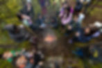 A high-angle, top-down photograph of a group of youth and mentors from the Pinehouse Photo