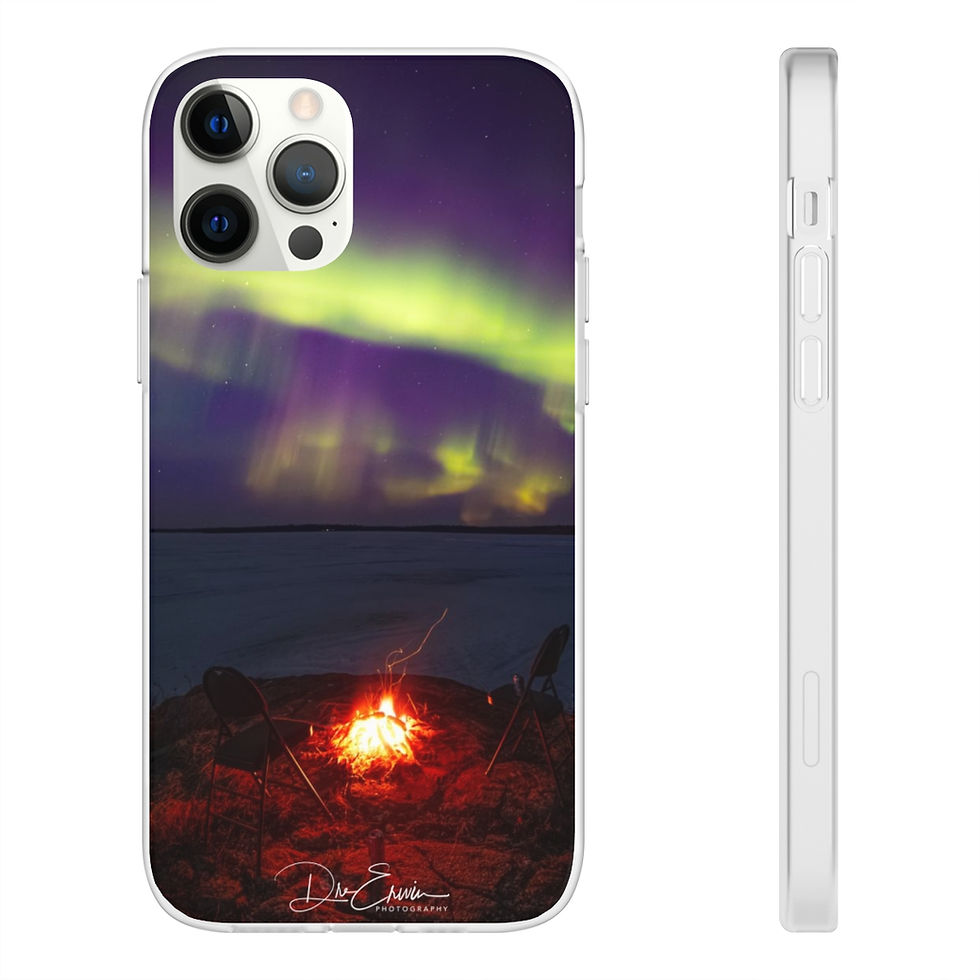 Miniature : Image description: An inspirational photograph by Dre Erwin captures the serene beauty of a campfire under the dancing Northern Lights at Pinehouse Lake, Saskatchewan, during the winter season. The warm glow of the fire contrasts with the ethereal display of the Aurora Borealis, creating a tranquil and uplifting scene, blending the natural wonders of the night sky with the comfort of a campfire