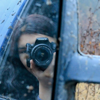 a moment of self-reflection - a youth taking photos of herself in Pinehouse Lake Photography club