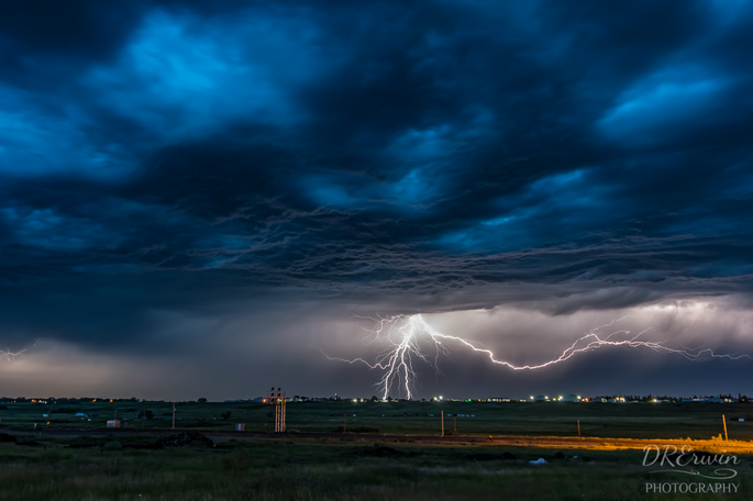 Dre Erwin's captivating photographs showcase a strange lightning storm over Moose Jaw, Saskatchewan, unveiling the unpredictable and captivating nature of electrical storms