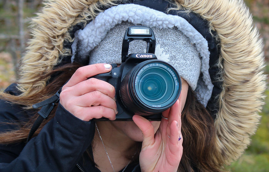 Indigenous youth member of Pinehouse Photography Club practicing therapeutic photography in Northern Saskatchewan, mentored by Dre Erwin RN AAP.