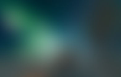 Man in front of the northern lights, in Pinehouse Lake