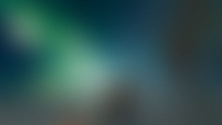 Man in front of the northern lights, in Pinehouse Lake