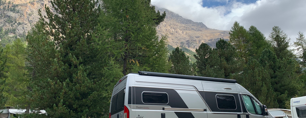 van with alpine peaks