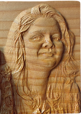 wooden carved portrait