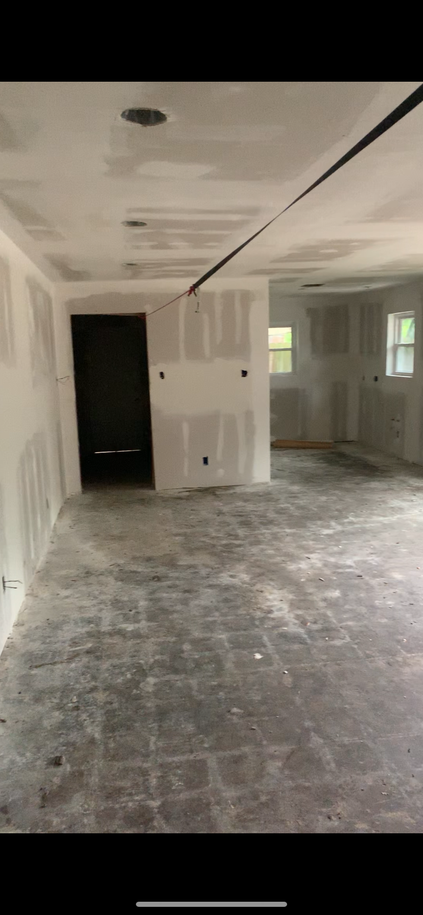 Small living area with kitchen and original garage entry