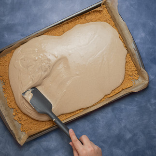 Spread the cheesecake batter evenly across your sheet and bake.