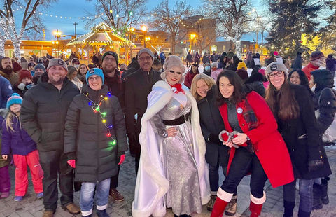 Diverse group, queen in silver gown, Festive Outdoor Events.