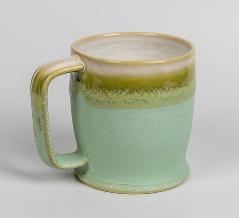 handmade white, green, and seafoam blue pottery mug made by turning wheel ceramics