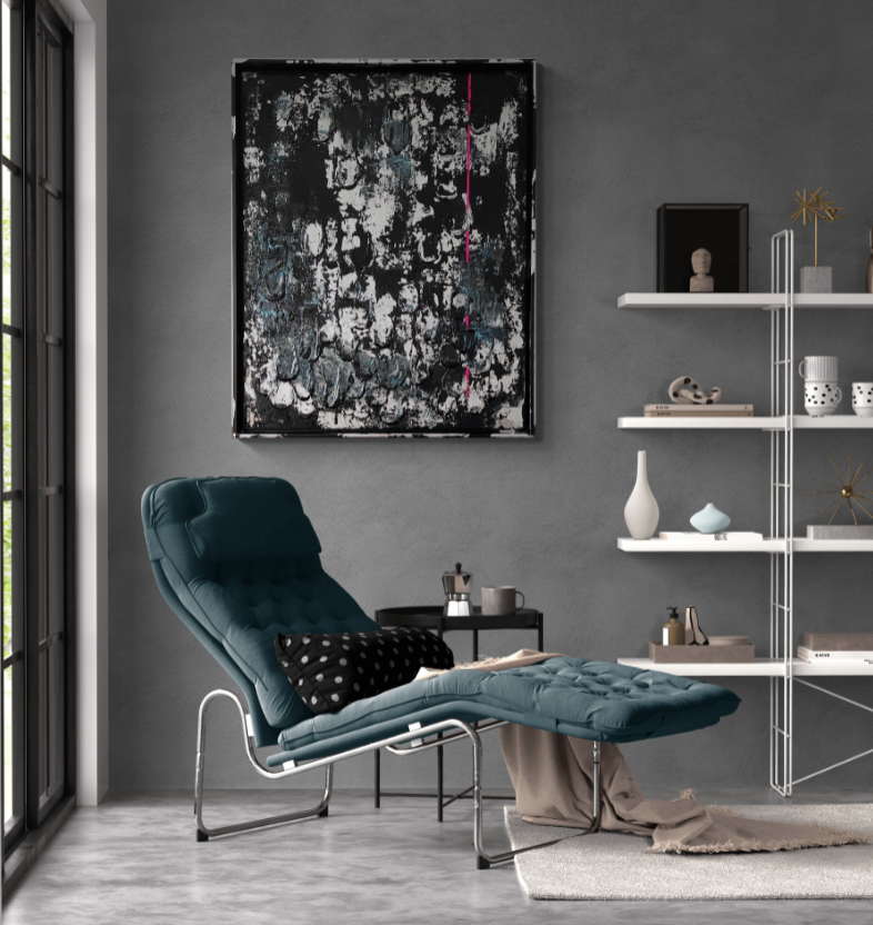 Tableau accroché dans un salon de lecture aux couleurs douces.