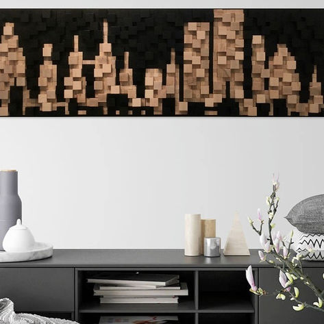 Tableau H3 représentant une ville aux gratte-ciel, présenté dans un intérieur moderne.