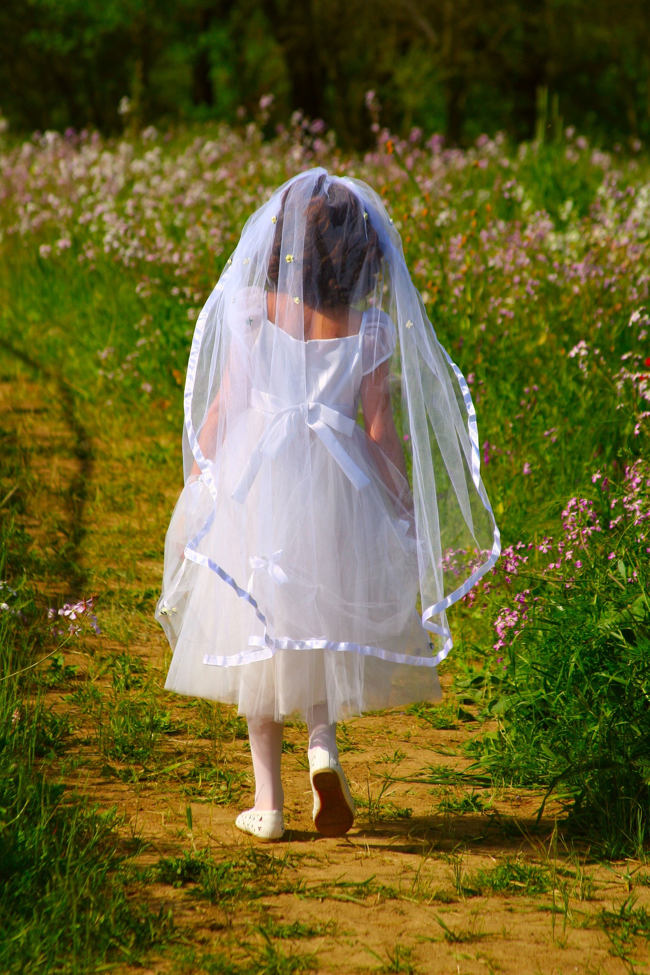 first-holy-communion girl with veil