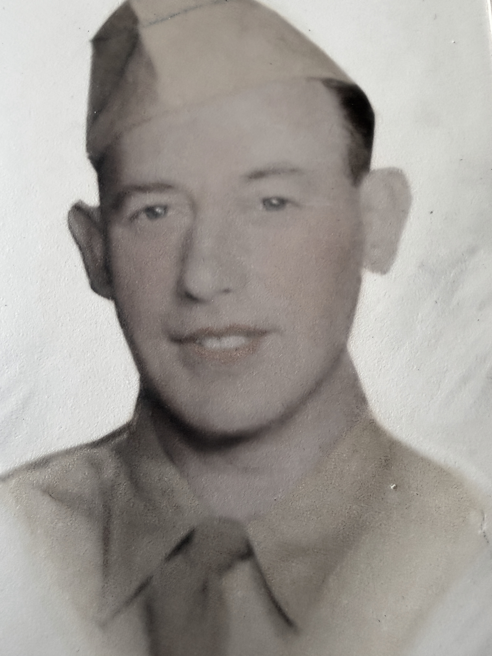 Black-and-white portrait of a World War II pilot who was killed during the Sicily campaign.