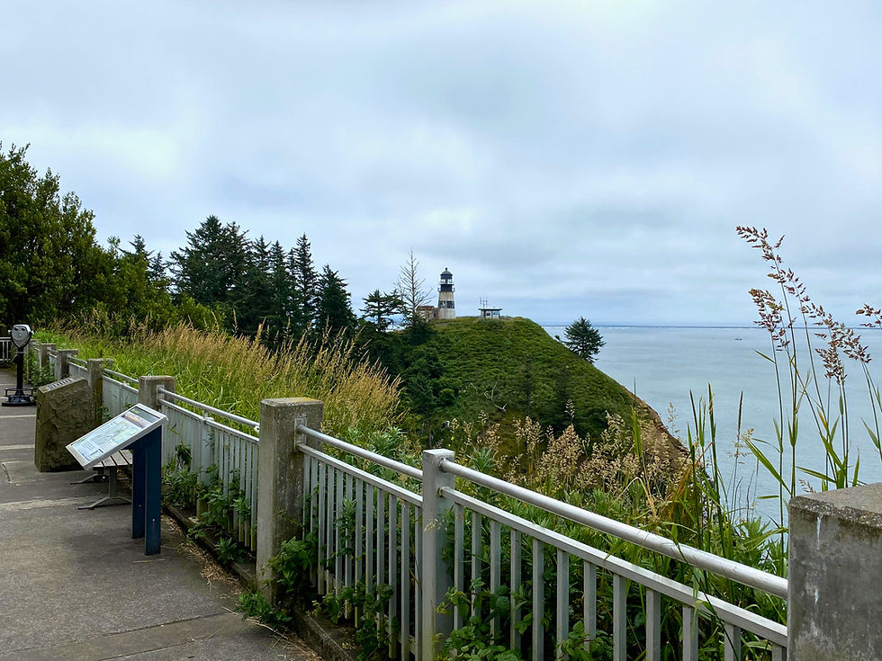 Cape Disappointment Lighthouse viewed from the Lewis and Clark Interpretive Center overlook in Washington State.