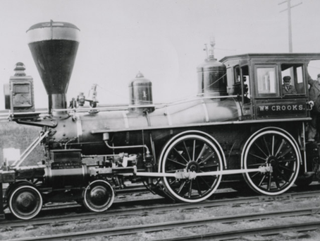Historical photograph of an early steam locomotive on the northern plains