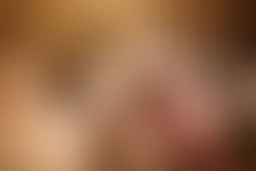 blonde woman hugs son and daughter in tall grass in Omaha, NE family session