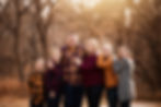 family of six hugging