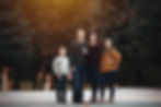 family standing on a road