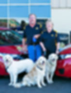 Midas of Richmond owners Mark & Patty Smith with their three dogs.
